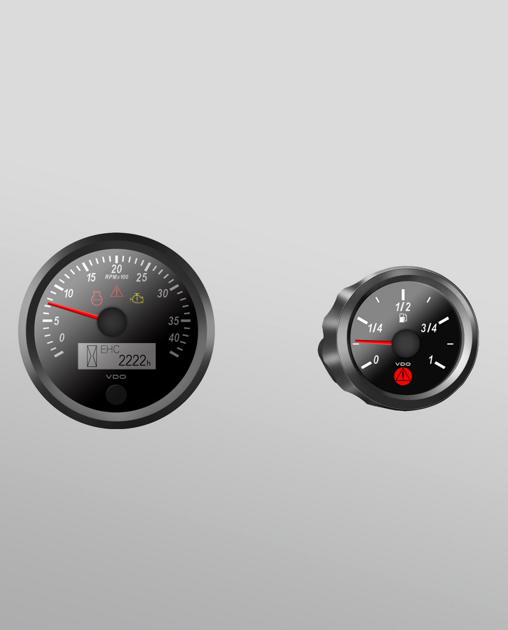 Image of three dial-type instruments next to each other in descending size. The display scales are white, the indicators are red.