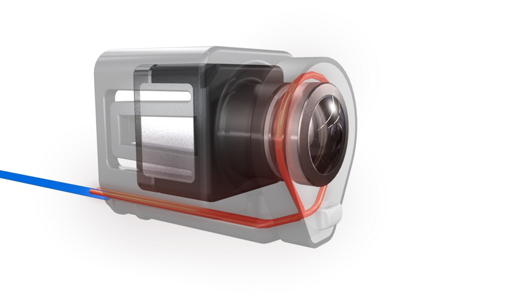 A partially transparent 3D rendering of a cylindrical motor with visible internal components, including windings, and a casing. A blue wire is connected to the unit, and a red outline highlights certain parts of the structure. The background is white.