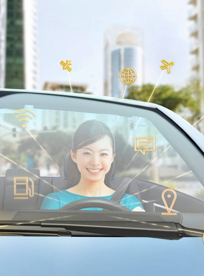 Woman inside a car with icons about cybersecurity