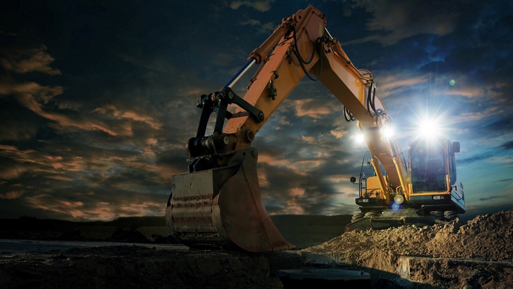 excavator works at sunrise