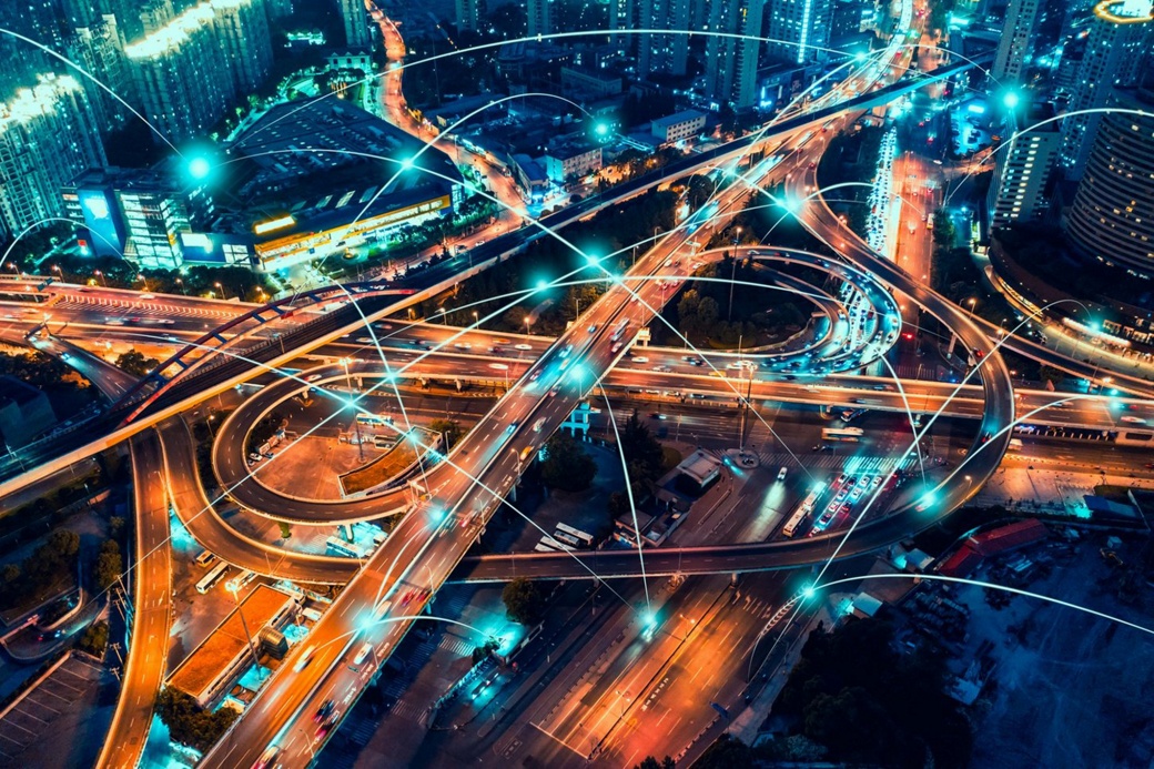 Night shot of a highway intersection with blue light effects