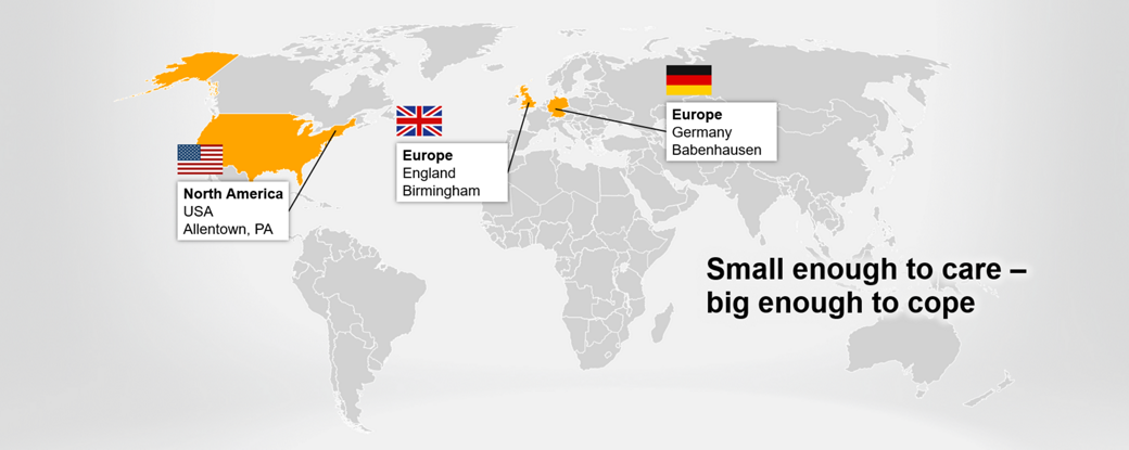 A world map highlighting locations in North America (Allentown, PA, USA) and Europe (Birmingham, England, and Babenhausen, Germany) with flags and labels. The text "Small enough to care – big enough to cope" is on the right side. The background is grey.