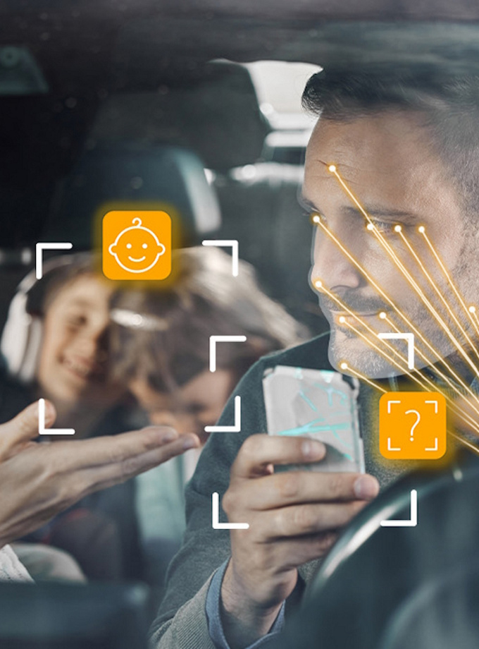 Family inside a car with cabin sensing software icons