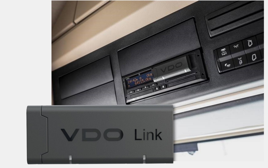 Picture of the front of a VDO Link plug-and-play dongle in the forefront and another one in the background stuck on the smart tachograph DTCO 4.1.